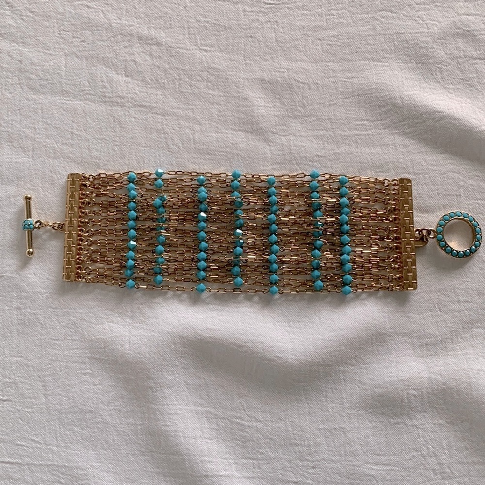 Vintage Designer Tommassini Gold tone multi strand with turquoise color crystals